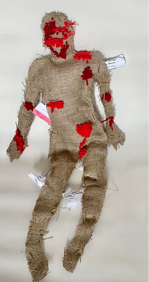 Burlap doll on white background