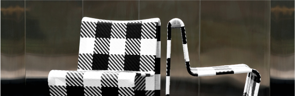 Two outdoor chairs with a black and white checkered pattern