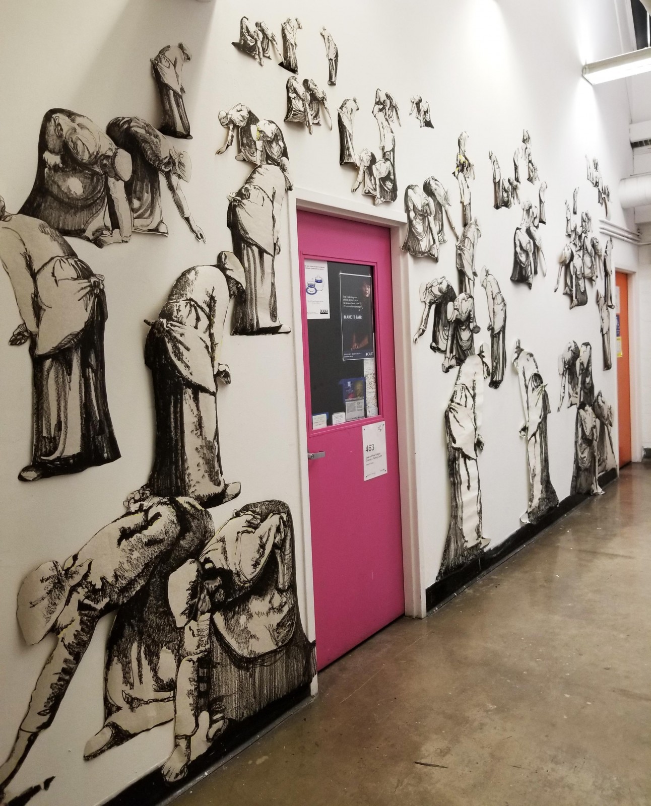 wall installation of illustrated workers 