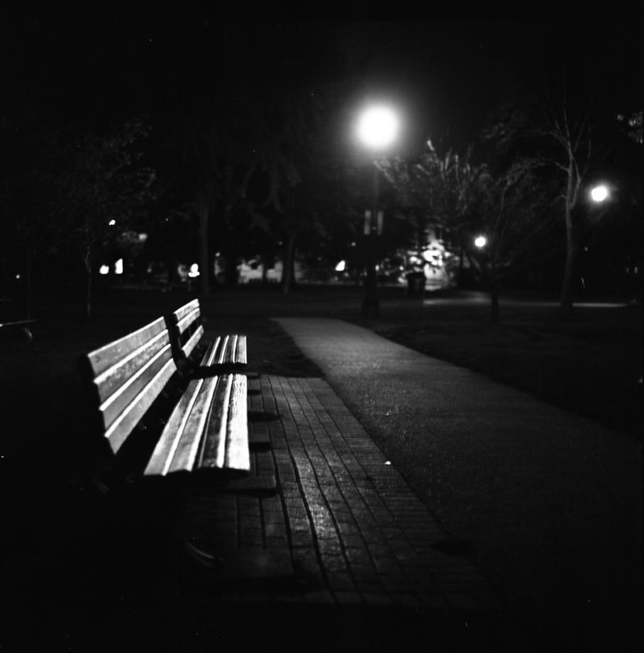 Photo of parkbench at night