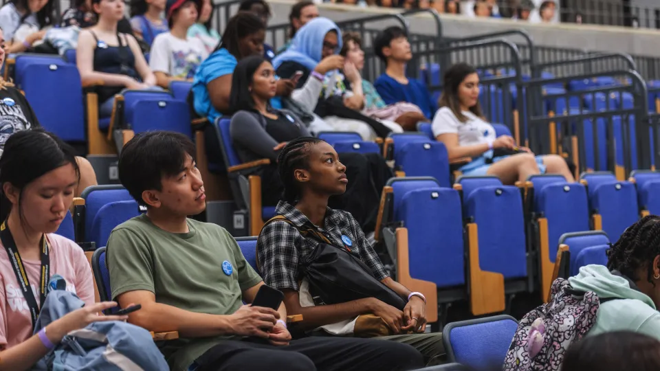 Students sitting in an auditorium.