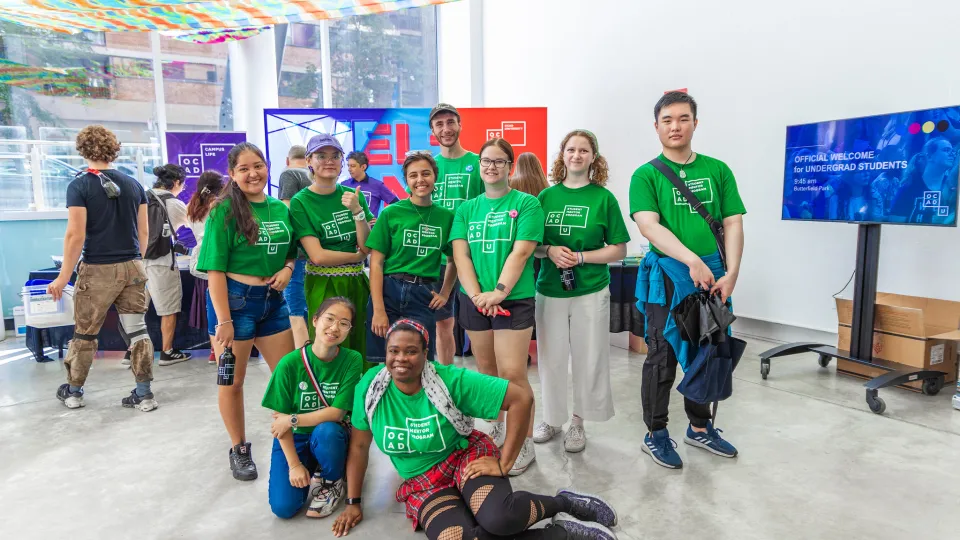 Students in the lobby of 100 McCaul