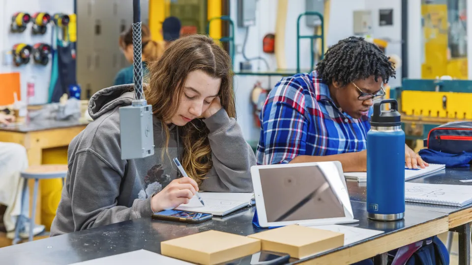 Students working in a busy workshop