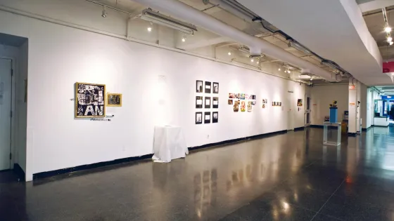 Gallery wall with various art pieces hung