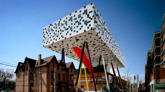 OCAD University's Sharp Centre for Design, with a graphic black and white facade suspended over primary colour support legs