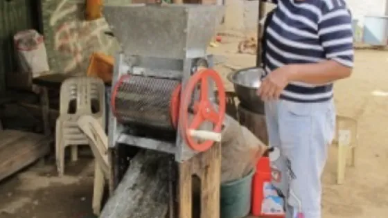 Person working at a machine outdoors