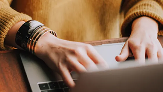 Person typing on a laptop