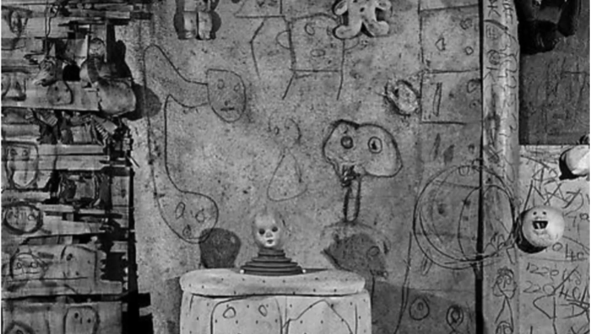 Room with spooky faces drawn on it