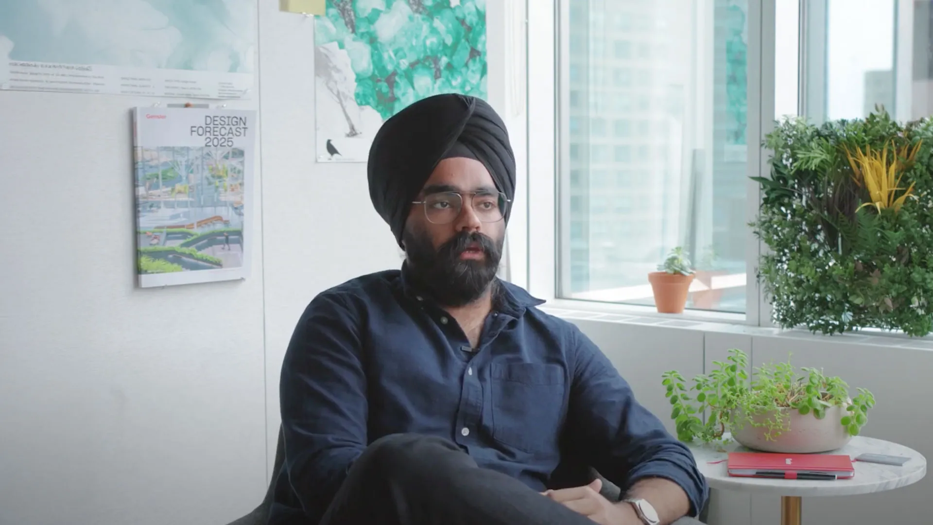 Sikh man sitting in room with window behind him