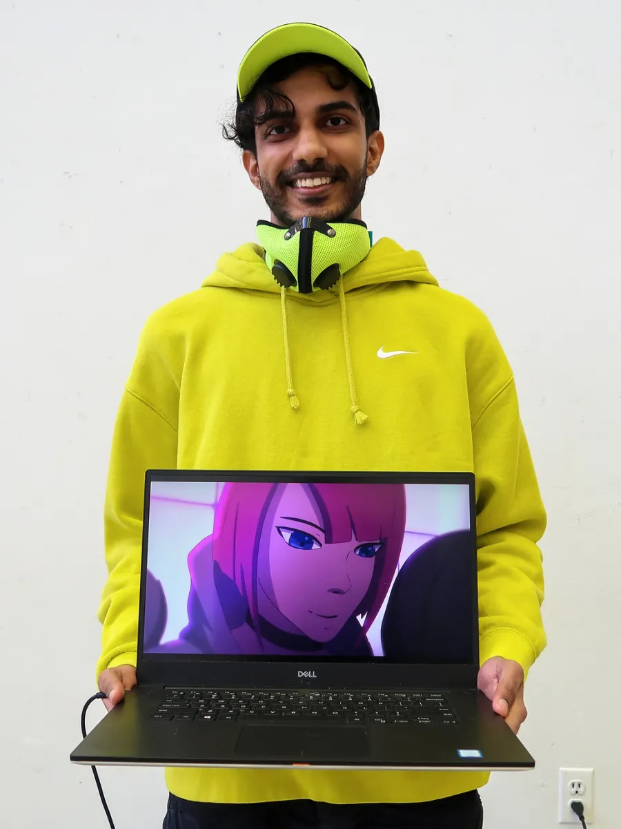 Student holding laptop