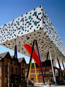 OCAD University's Sharp Centre for Design, with a graphic black and white facade suspended over primary colour support legs