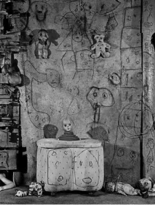 Room with spooky faces drawn on it