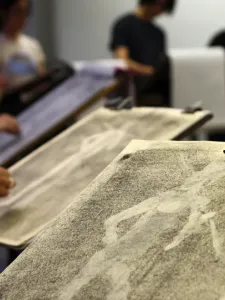 A close up photo of a drawing board with a life drawing sketch.