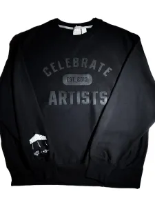 Black sweatshirt with white letters: Celebrate Artists and the OCADU logo is on the sleeve.