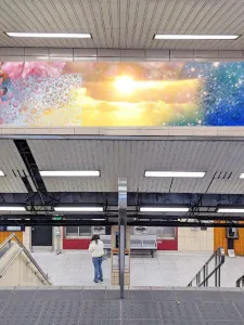 View of descending stairs at Christie Station with virtual mock-up of art installation overhead. 