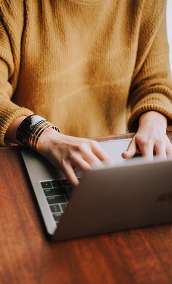 Person typing on a laptop