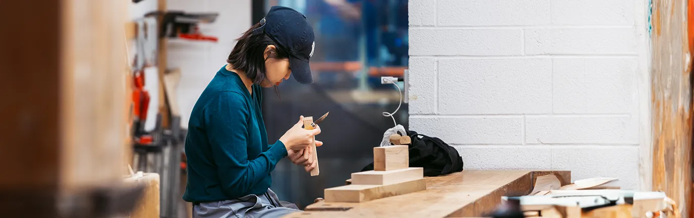 Student working on a project in the woodshop