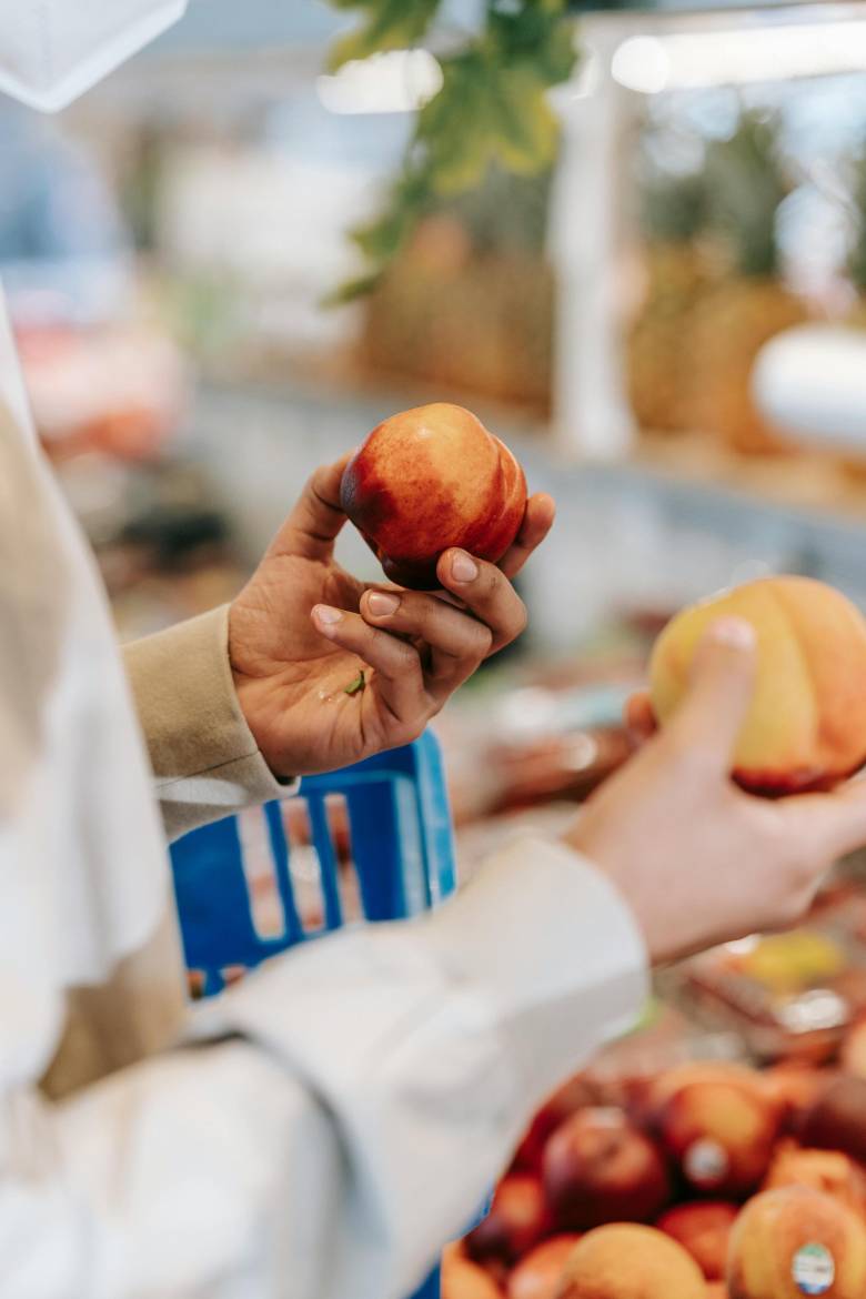 hands holding fruit