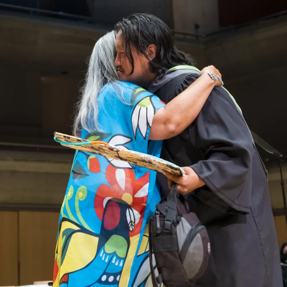 Elder Liz Osawamick and graduating student Afanassi Grigoriev (BDES - Illustration) at OCAD U's 2022 Convocation.