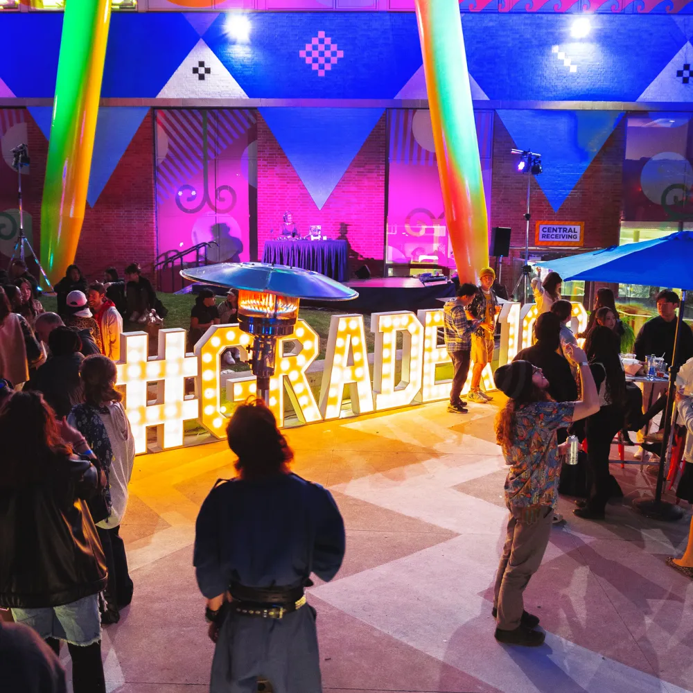 GRADEX Light up sign in a crowed space