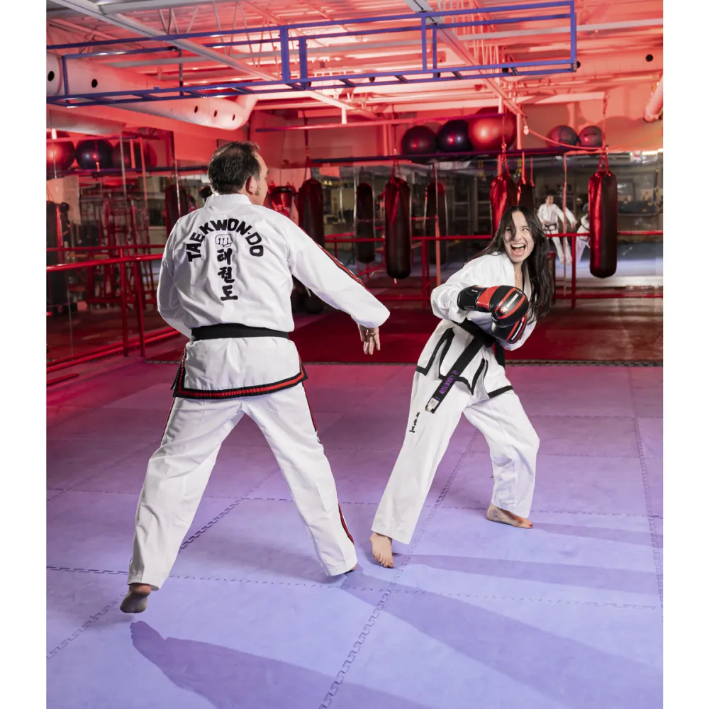 Photo of man and women doing karate