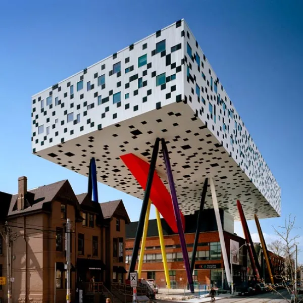 OCAD University's Sharp Centre for Design, with a graphic black and white facade suspended over primary colour support legs