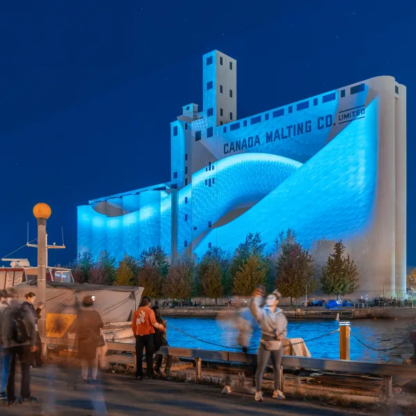 Projection on a large concrete building in the distance