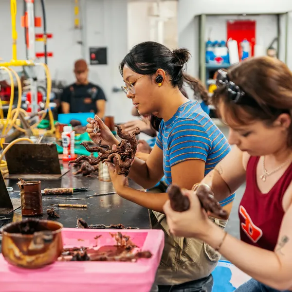 Students working on clay