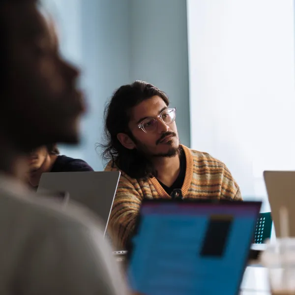 Students in a seminar room with laptops