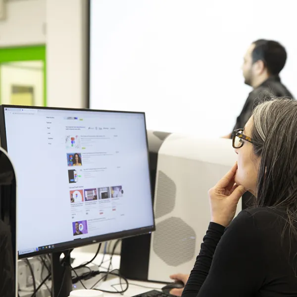 Person working at large computer screen