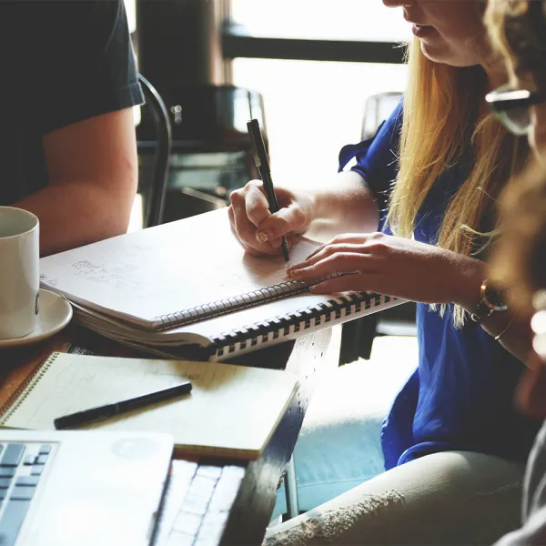 People working at a desk collaboratively